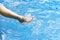Enjoy beautiful girl relaxing in swimming pool, Legs of woman in water.