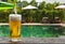 Enjoy beer beside swimming pool.