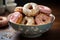 Enjoy a delightful ceramic bowl filled with freshly glazed donuts