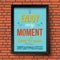 Enjoy every moment here and now. Stylized retro poster in a frame. Brick wall background. Vector illustration.