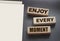 Enjoy Every Moment words written on wood block.s Positive lifestyle concept