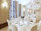 Enjoy a luxurious white restaurant table.