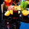 Enjoy a variety of specialty cocktails. Whiskey cocktail drinks in glasses. Cocktails garnished with ice cubes, fruit