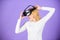 Enjoy virtual reality. Woman hold vr headset glasses violet background. Digital device and modern opportunities. Virtual