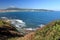 Enjoying beautiful view on atlantic ocean with mountain jaizkibel in blue sky