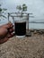 Enjoying a black coffee by the sea is very pleasant. Try and feel the sensation