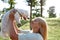 Enjoying girl holding her cute furry Maltese dog