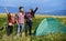 Enjoying his summer vacation. man and two girls pitch tent. wanderlust discovery. hiking outdoor adventure. group of