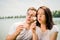 Enjoying life - couple blowing dandelions