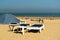 Enjoying life. People relaxing on the sandy beach during vacation on sunny day