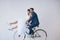 Enjoying lifes ride with my soulmate by my side. Studio portrait of a newly married young couple riding a bicycle