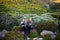 Enjoying the mountains and the company of a friend. two attractive young female hikers in the outdoors.