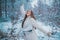 Enjoying nature wintertime. Vintage winter person. Girl playing with snow in park. Beautiful young woman laughing