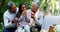 Enjoying a picnic feast of their own at the park. 4k video footage of grandparents having a picnic with their little