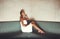 Enjoying the simple things in life. Full length shot of a young woman relaxing in the sauna at a spa.