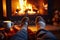 enjoying with socked feet legs resting near fireplace with a coffee cup in home