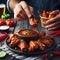 Enjoying Spicy Chicken Wings With Dipping Sauce at a Casual Evening Gathering