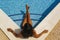 Enjoying suntan. Vacation concept. Top view of slim young woman in bikini