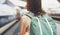 Enjoying travel. Young woman waiting on the station platform with backpack on background electric train. Tourist plan route