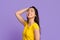 Enjoying Youth. Beautiful Young Asian Female Posing In Studio Over Purple Background