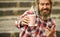 enjoys relaxing on weekend. selective focus. morning drinks concept. student on coffee break. bearded man drinking