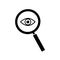 Enlarged eye through a magnifying glass, black icon. Isolated on white background vector