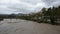 The enlarged Piave river passes through Belluno under an intense rain