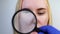 Enlarged pores, black spots, acne, rosacea close-up on the cheek. A woman is being examined by a doctor. Dermatologist examines th