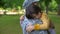 Enlisted army soldier hugging sad son before leaving for war, family separation