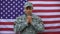 Enlisted male joining hands, praying for peace, american armed forces patriotism