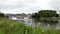 Enniskillen, Northern Ireland - July 20 2022 : Yacht passing Enniskillen Castle at Lough Erne in County Fermanagh