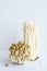 Enoki and shimeji edible mushrooms on white