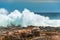 An enormous wave crashing against the rocks at Storms River Mouth, Tsitsikamma National Park, South Africa