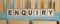 ENQUIRY word written on wooden blocks over light blue background