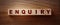 Enquiry word written on wooden blocks on wooden table