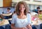 Enriching eager young minds. Portrait of a happy young teacher with her students in the background.