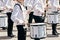 The ensemble of drummers in white ceremonial dress