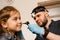 ENT doctor with otoscope. Otoscopy. Pediatrician otolaryngologist looks through otoscope the ears of child. Otoscopy