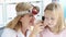 ENT woman conducts physical examination of ear with otoscope of little girl 4k movie