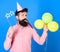 Entertainer with colorful baloons at kids party, international childrens day. Bearded artist with party wistle and paper