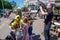 Entertainer playing with happy kids during children protection day while photographer takes photos