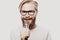 The entertainer. Young talking man holding microphone, Isolated on white background.