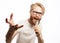 The entertainer. Young talking man holding microphone, Isolated on white background.