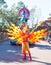 Entertainers in colorful costumes participating in DisneyWorld parade