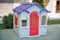Entertainment area.kids playhouse in the entertainment center. Plastic children play house . Green floor. Joy and fun. Playing