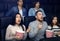 Entertainment and fun. Emotional people with popcorn watching thriller in cinema