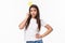 Entertainment, fun and holidays concept. Portrait of sassy and classy good-looking girl in t-shirt, holding carnaval