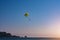 Entertainment on the sea. A man parachutes over water