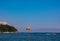 Entertainment on the sea. A man parachutes over water