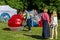 Entertainment of zorbing in the park. Children rolling downhill inside an orb sphere. Enjoy of childhood.